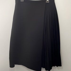 Top shop back half pleated wrap around skirt. Size 2 lined and knee length.